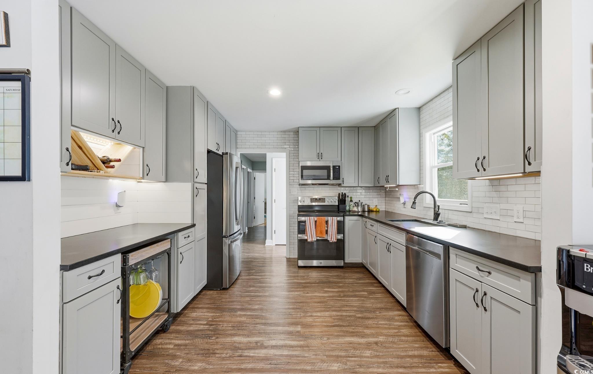 78 Wicklow Way Pawleys Island, SC 29585 - Photo 8 of 37 Kitchen featuring dark countertops, gray cabinetry, appliances with stainless steel finishes, and recessed lighting