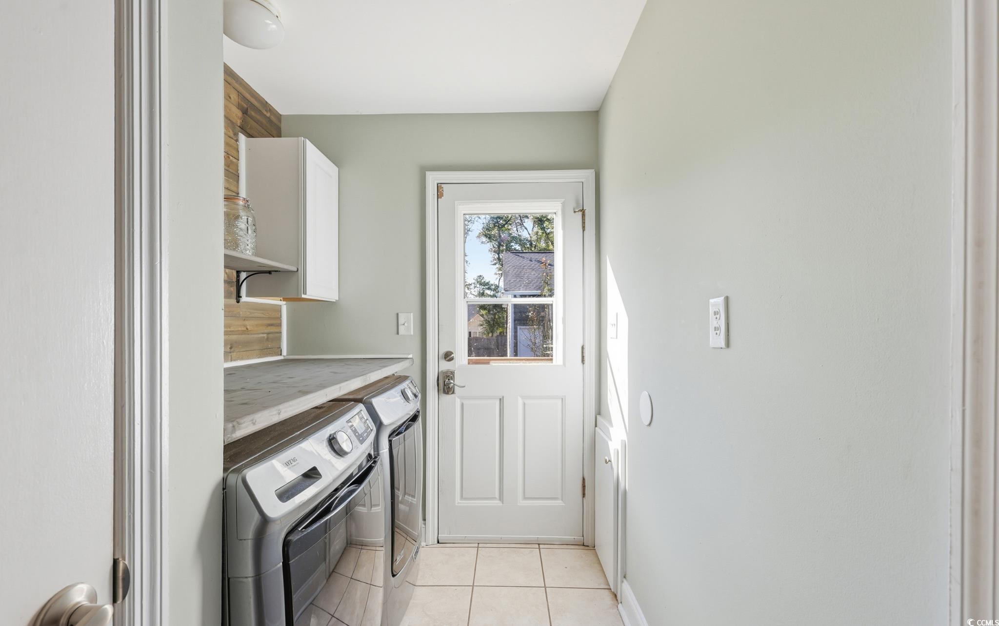 78 Wicklow Way Pawleys Island, SC 29585 - Photo 10 of 37 Washroom with light tile patterned flooring and separate washer and dryer