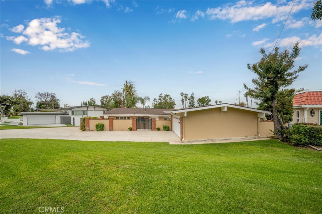 5531 Rockledge Drive Buena Park, CA 90621 - Photo 3 of 64 a view of a house with a yard and a porch