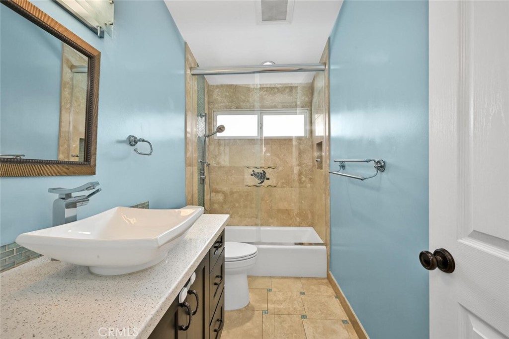 5531 Rockledge Drive Buena Park, CA 90621 - Photo 38 of 64 a bathroom with a sink and a mirror