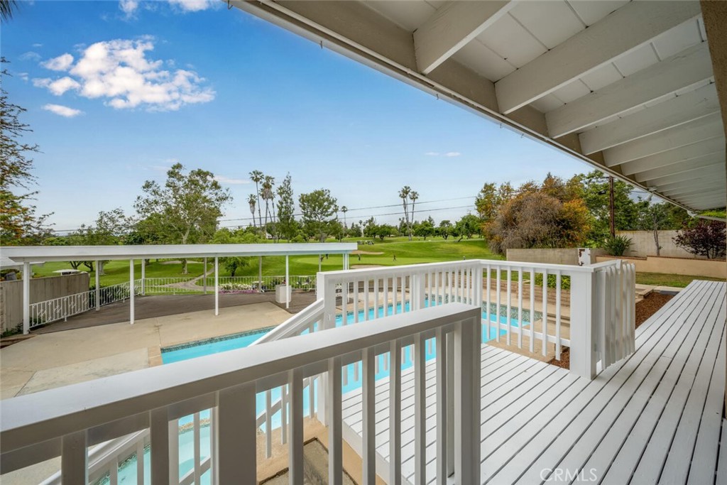 5531 Rockledge Drive Buena Park, CA 90621 - Photo 45 of 64 a view of a balcony with wooden floor and iron fence