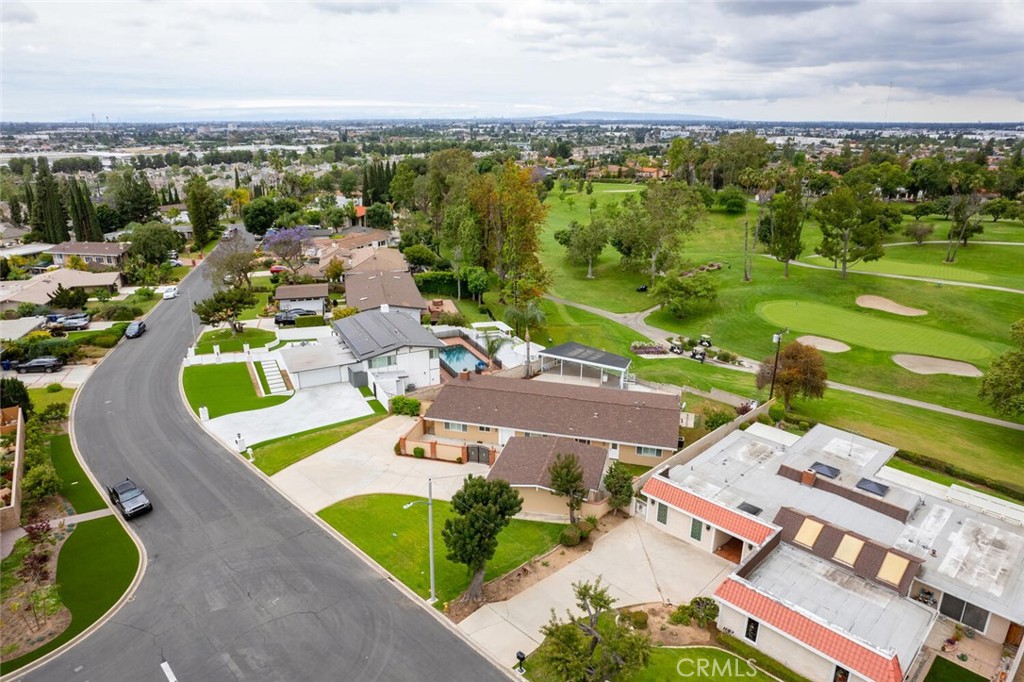5531 Rockledge Drive Buena Park, CA 90621 - Photo 54 of 64 an aerial view of a house with a swimming pool yard and mountain view in back