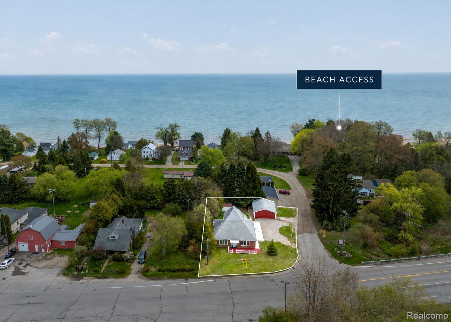 2400 North Lakeshore Road Carsonville, MI 48419 - Photo 33 of 33 Aerial view of residential area with property parcel outlined and a large body of water