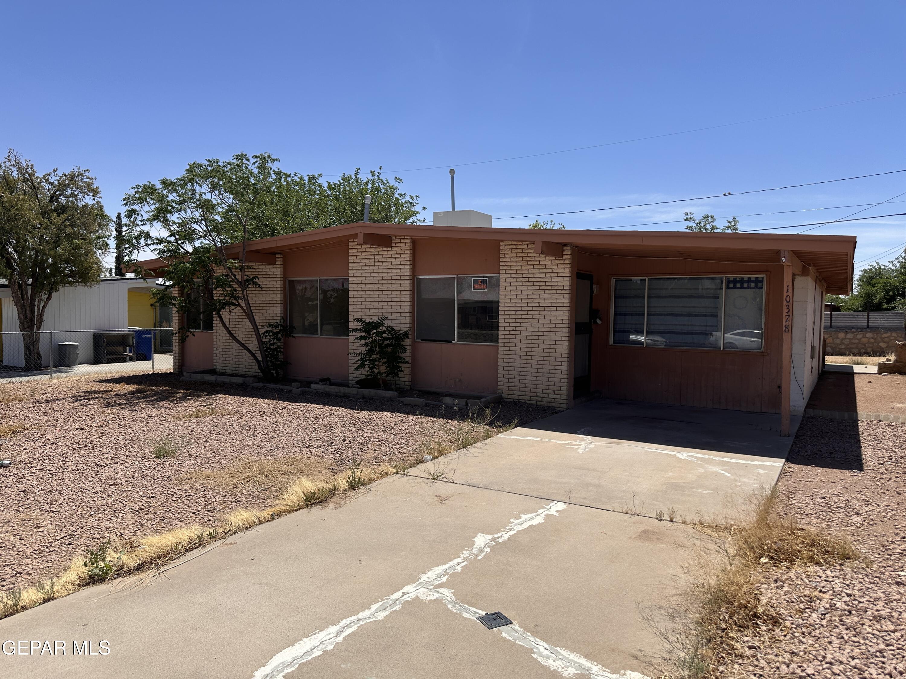 10378 Yellowstone Street El Paso, TX 79924 - Photo 2 of 5 a front view of a house with a yard
