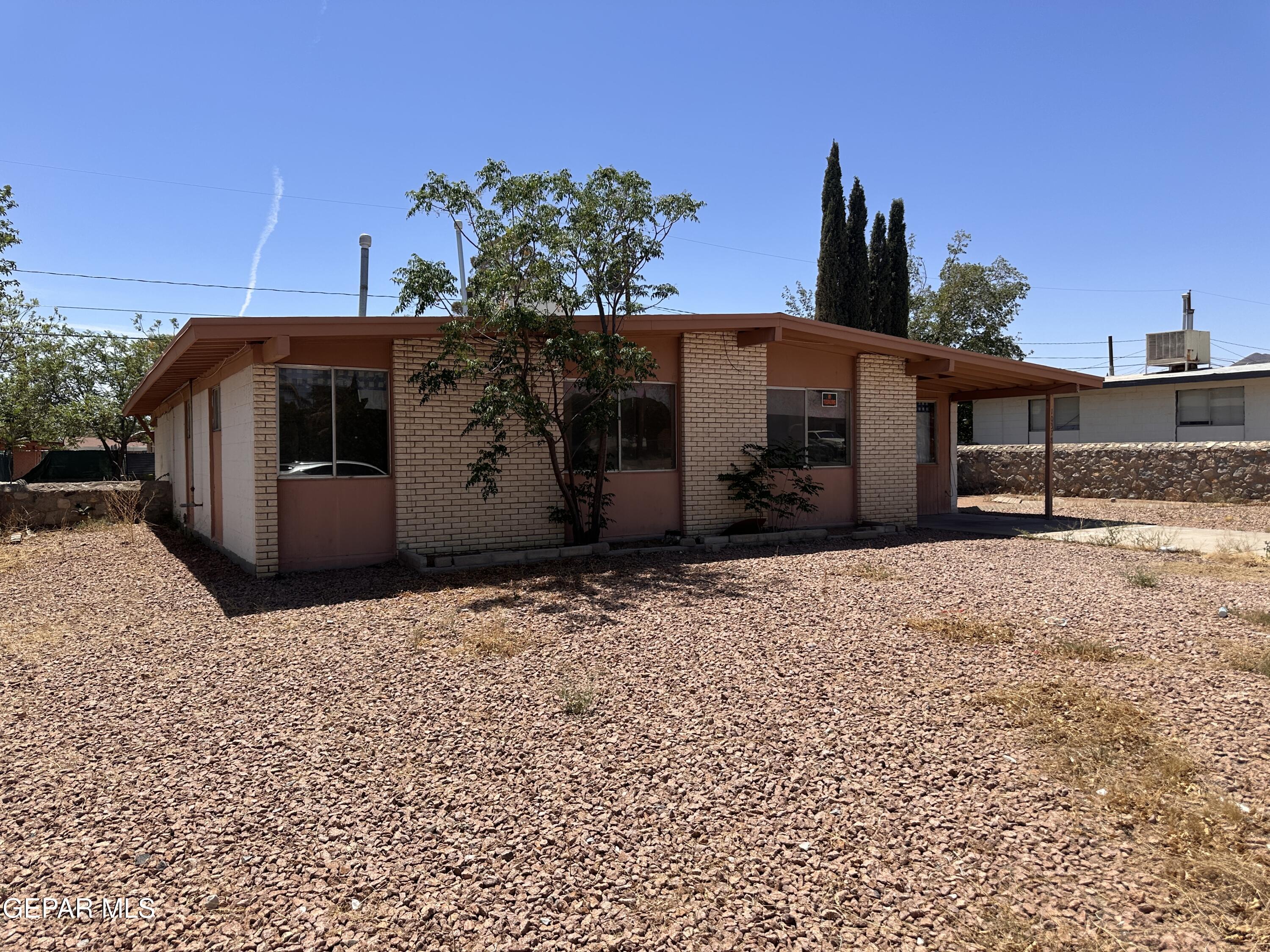 10378 Yellowstone Street El Paso, TX 79924 - Photo 4 of 5 a front view of a house with a yard