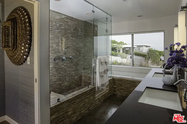 a bathroom with a sink and a shower