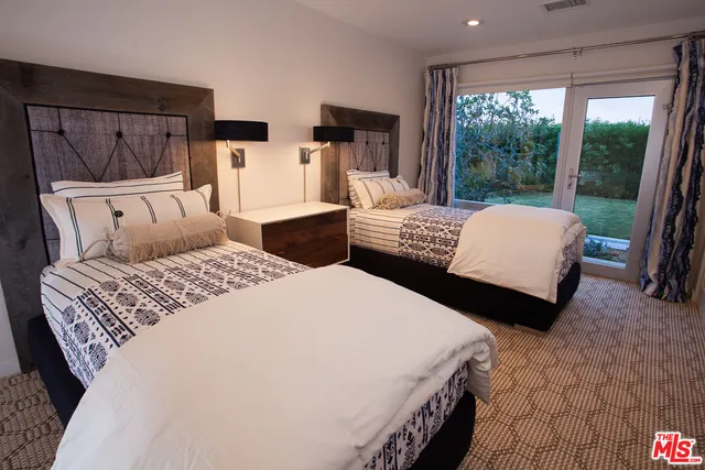 a bedroom with a bed and a table