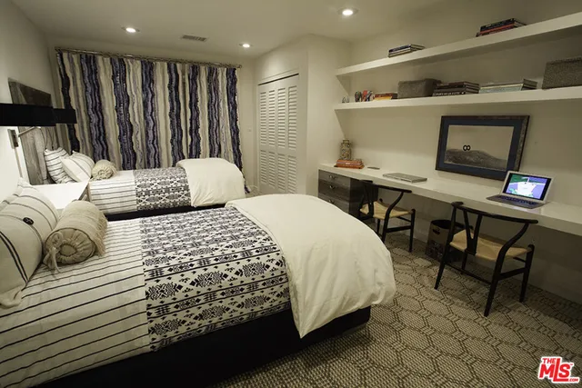 a room with a wooden floor and furniture