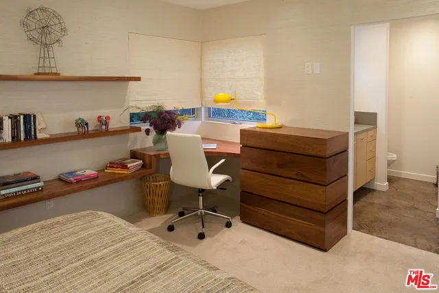 a bedroom with a bed and furniture