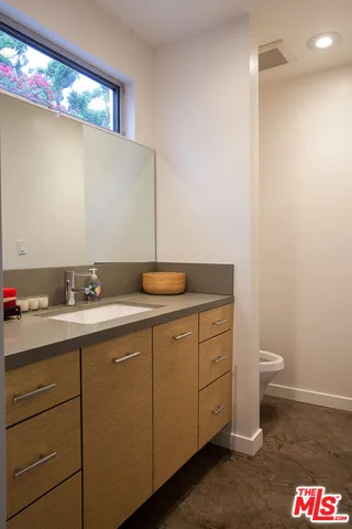a living room with furniture tv and a large window