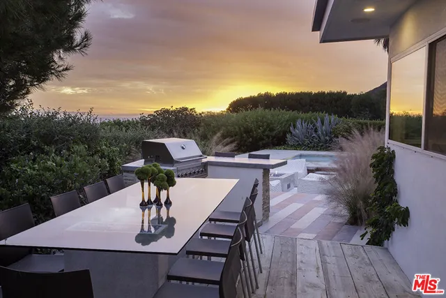 a view of a swimming pool with chairs