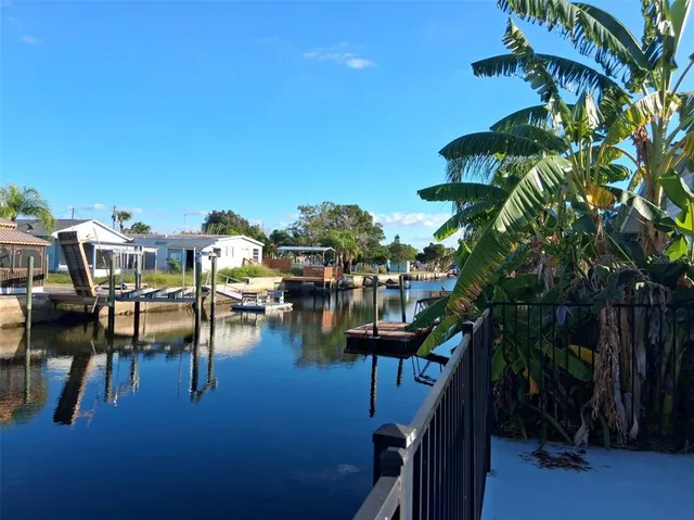 a view of a chairs and table in patio