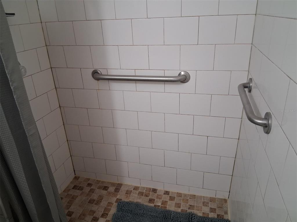 14982 Edgewater Circle Hudson, FL 34667 - Photo 14 of 22 a bathroom with a shower