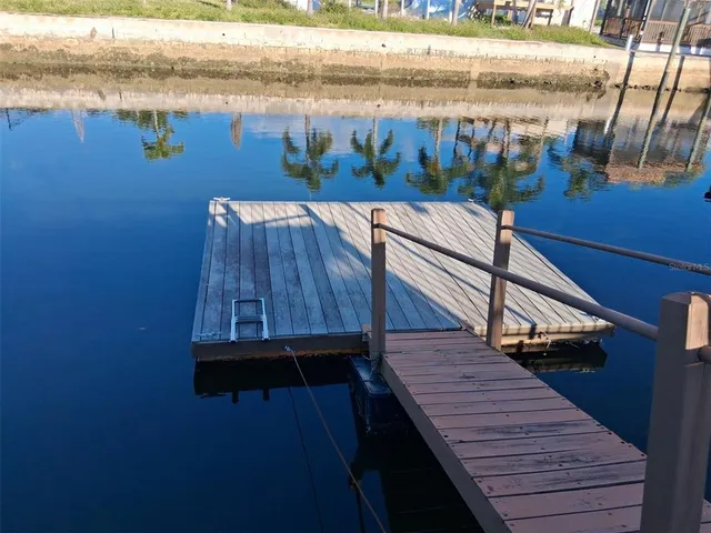 a wooden bench sitting on top of a wooden deck