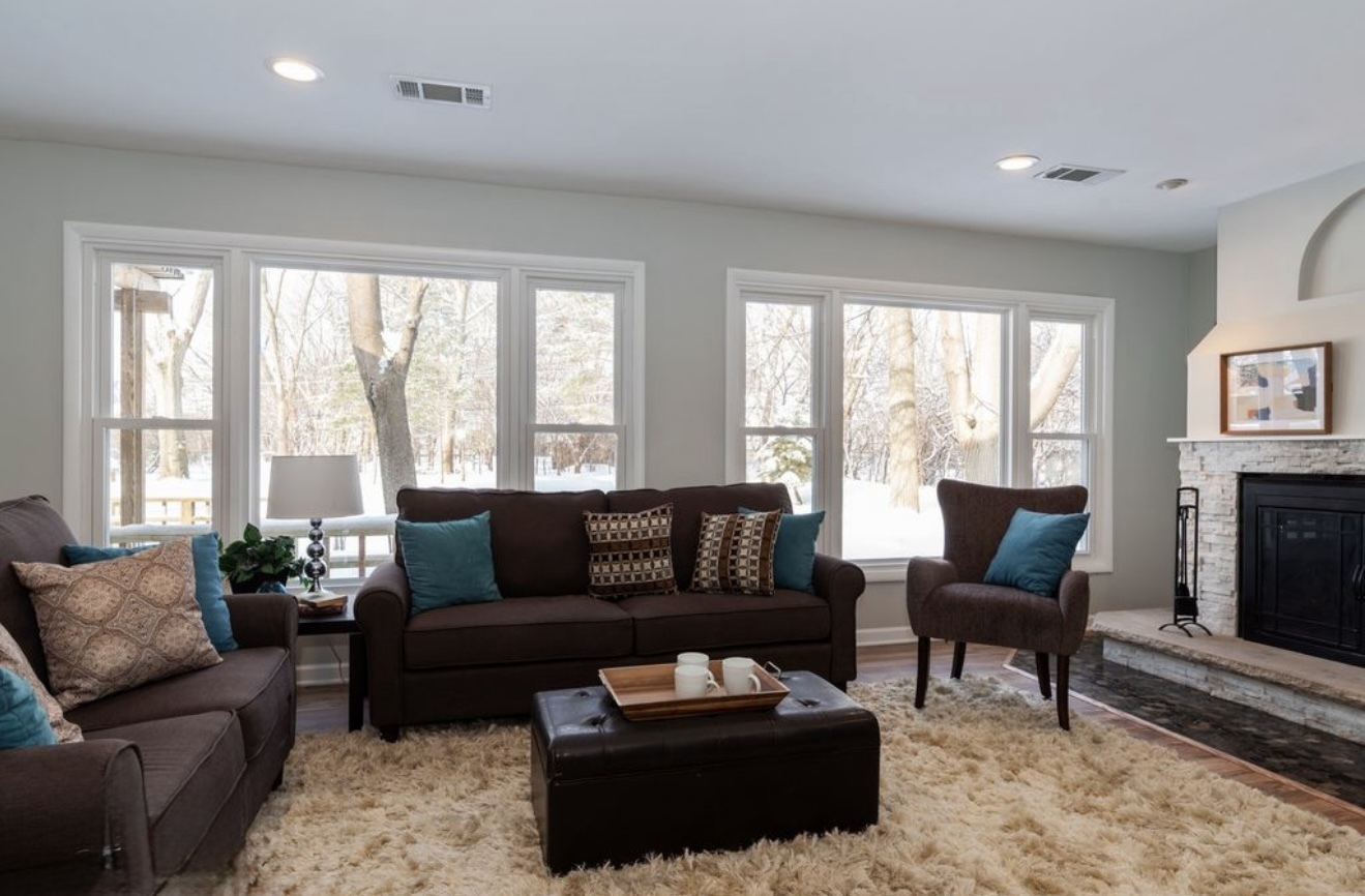 684 Pfingsten Road Northbrook, IL 60062 - Photo 20 of 33 a living room with furniture and a fireplace