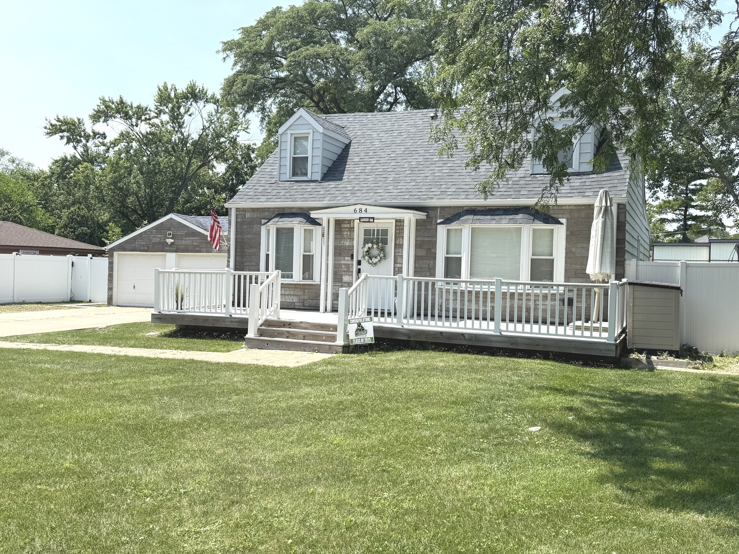684 Pfingsten Road Northbrook, IL 60062 - Photo 3 of 33 a view of a house with a big yard and large trees