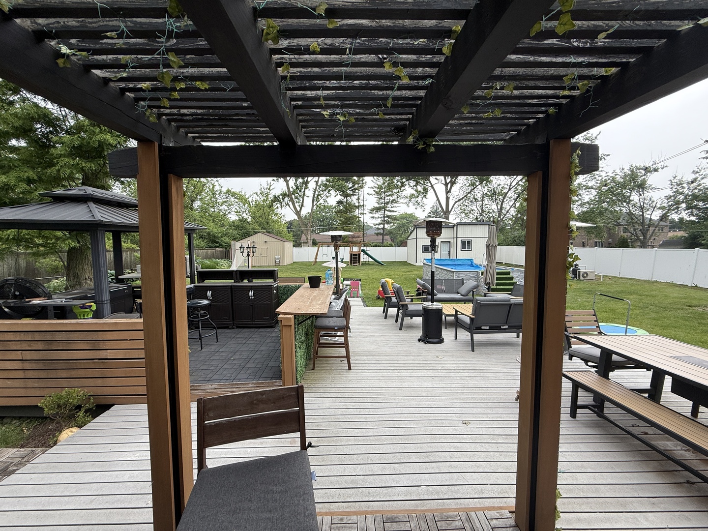 684 Pfingsten Road Northbrook, IL 60062 - Photo 8 of 33 a view of a patio with chairs and wooden floor next to a yard