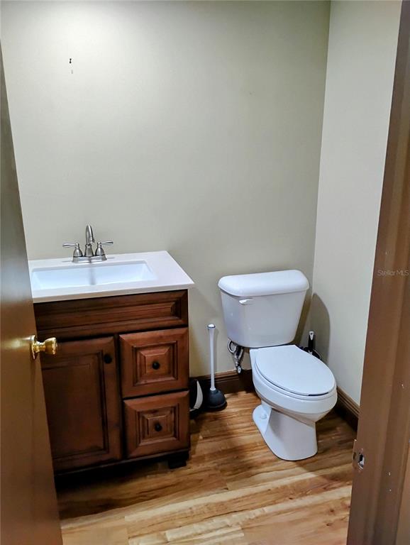 11721 Raintree Drive Tampa, FL 33617 - Photo 9 of 12 a bathroom with a sink and a toilet