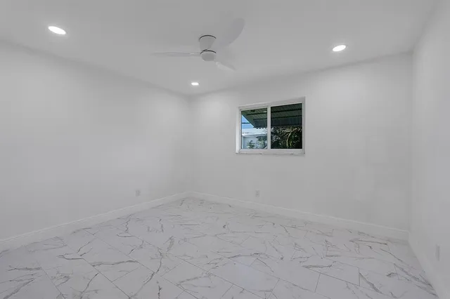 an empty room with a empty space and a window