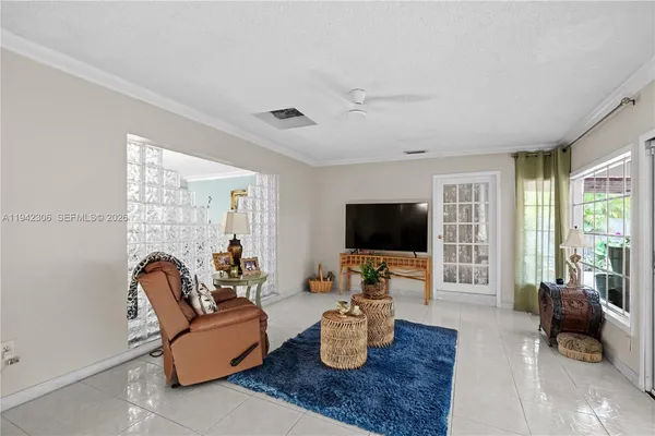 a living room with furniture and a flat screen tv