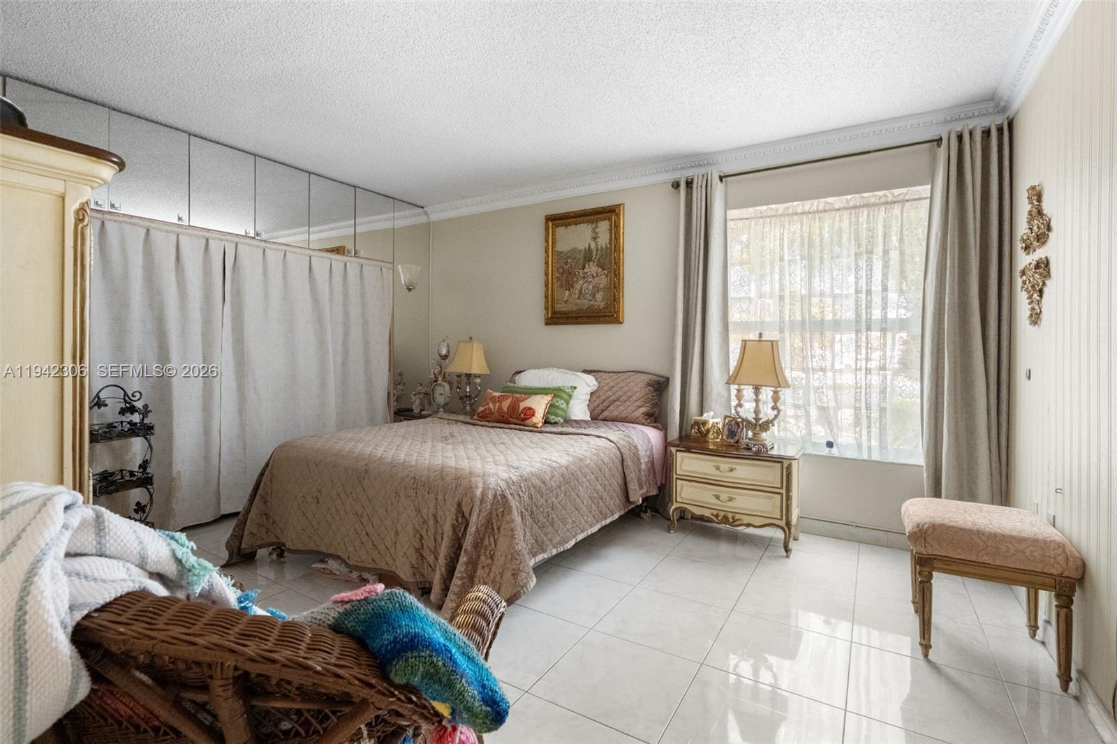 13220 Southwest 5th Street Miami, FL 33184 - Photo 18 of 35 a bedroom with a bed and a chair