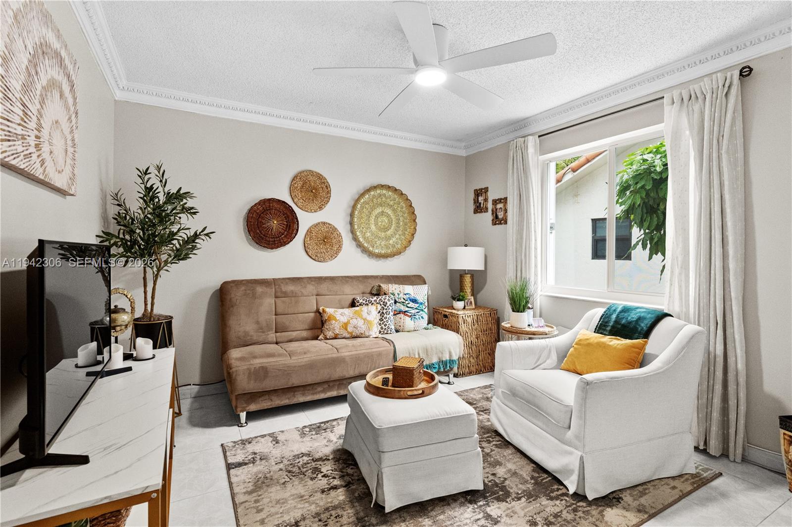 13220 Southwest 5th Street Miami, FL 33184 - Photo 19 of 35 a living room with furniture and a large window