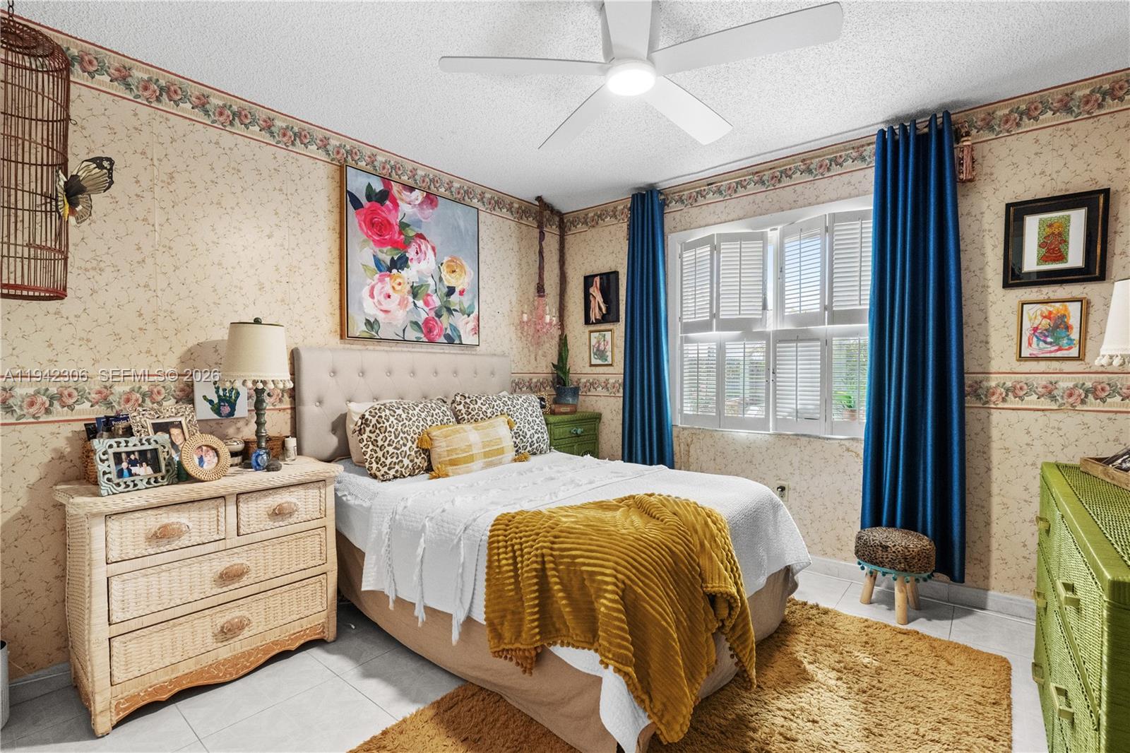 13220 Southwest 5th Street Miami, FL 33184 - Photo 21 of 35 a bedroom with a bed and a window