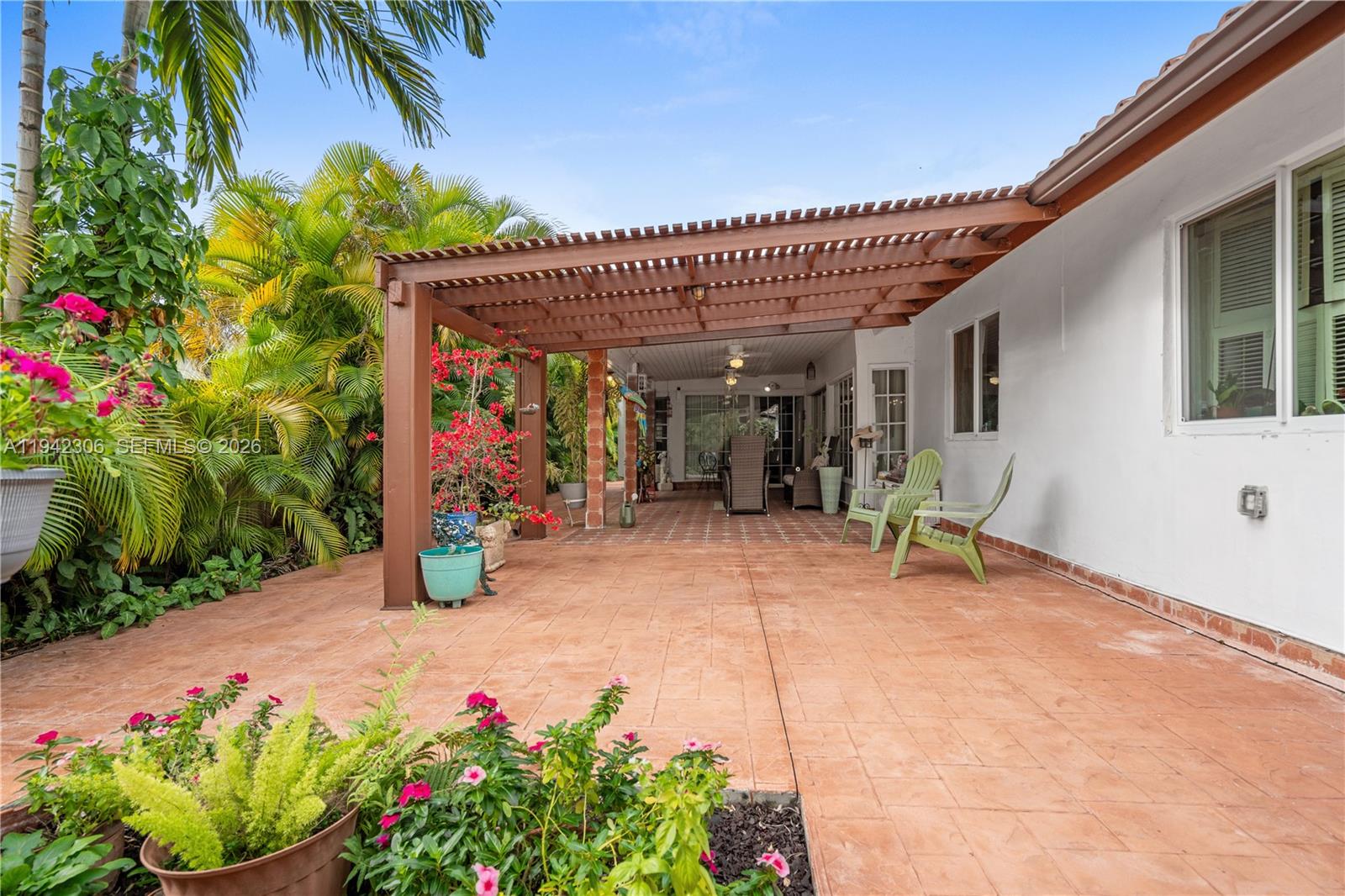 13220 Southwest 5th Street Miami, FL 33184 - Photo 28 of 35 a view of a patio with table and chairs and potted plants