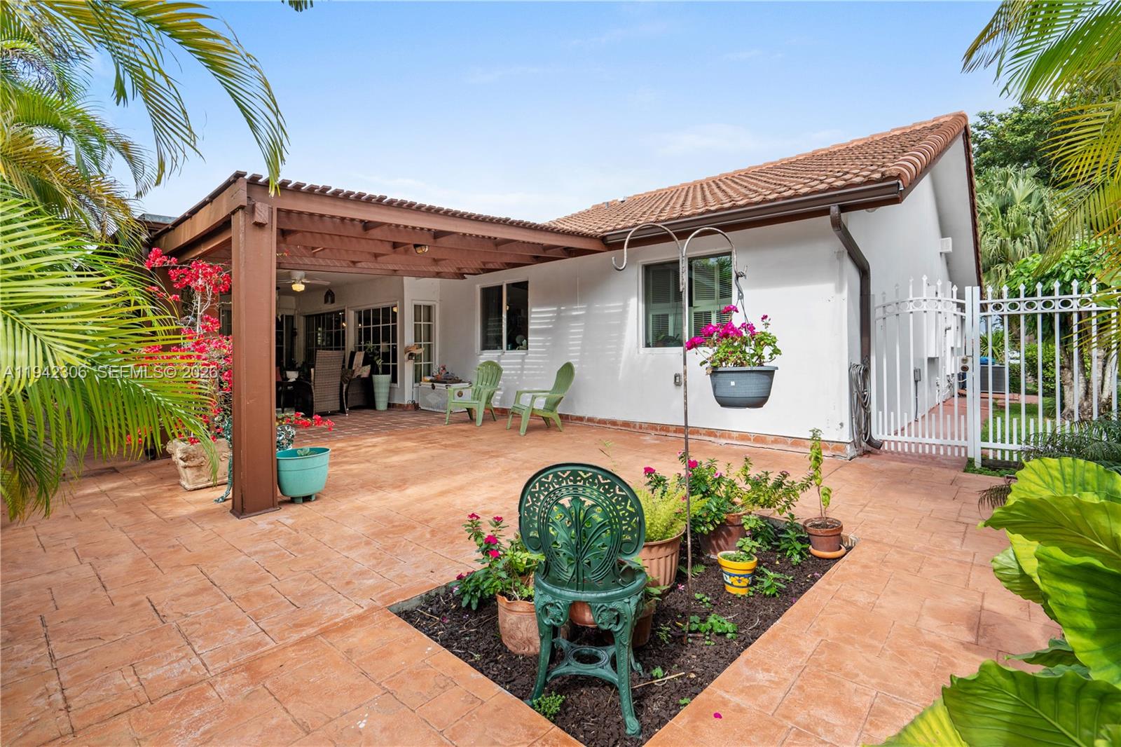 13220 Southwest 5th Street Miami, FL 33184 - Photo 30 of 35 a front view of a house with garden