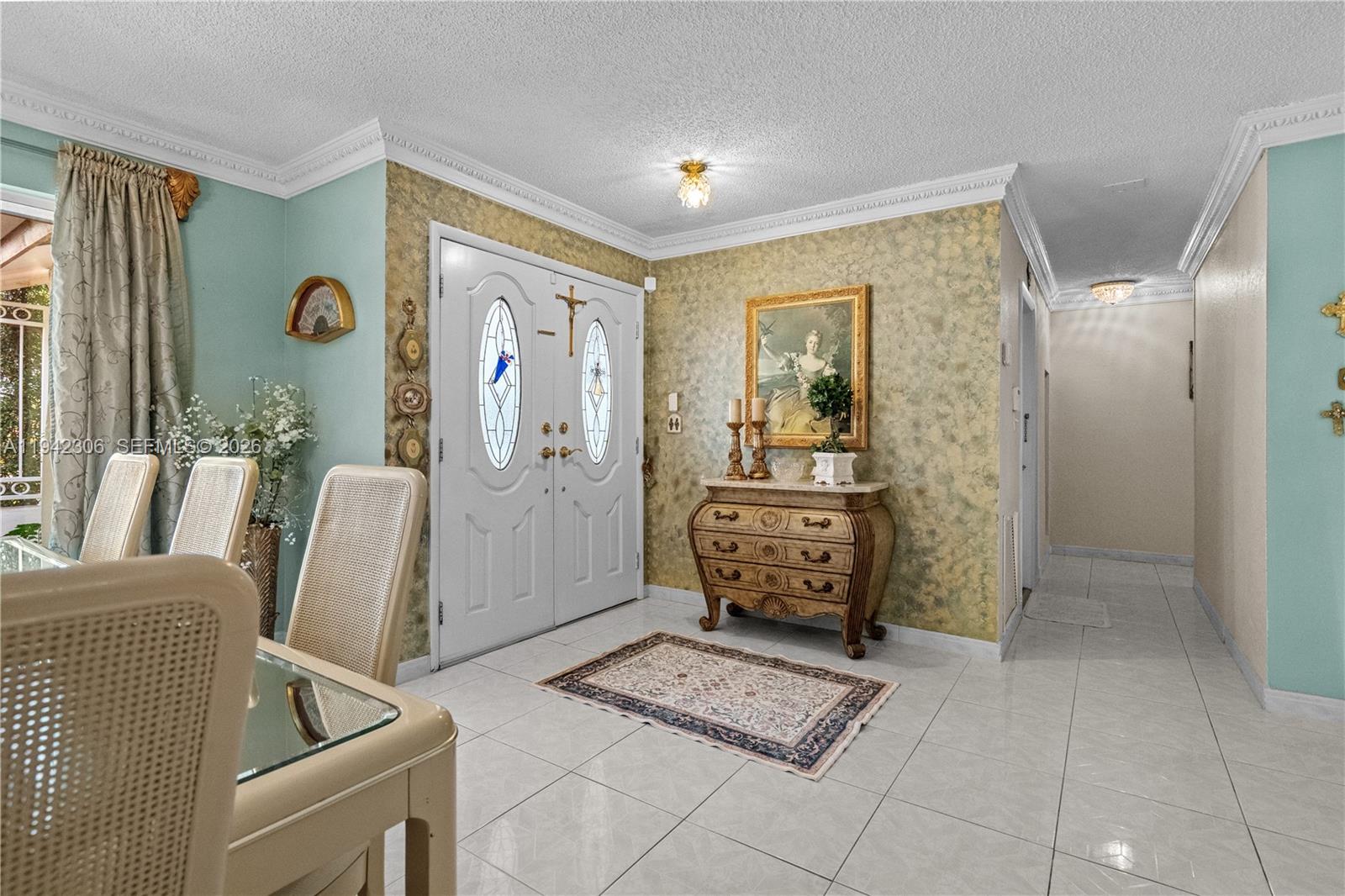 13220 Southwest 5th Street Miami, FL 33184 - Photo 6 of 35 a living room with furniture and a table