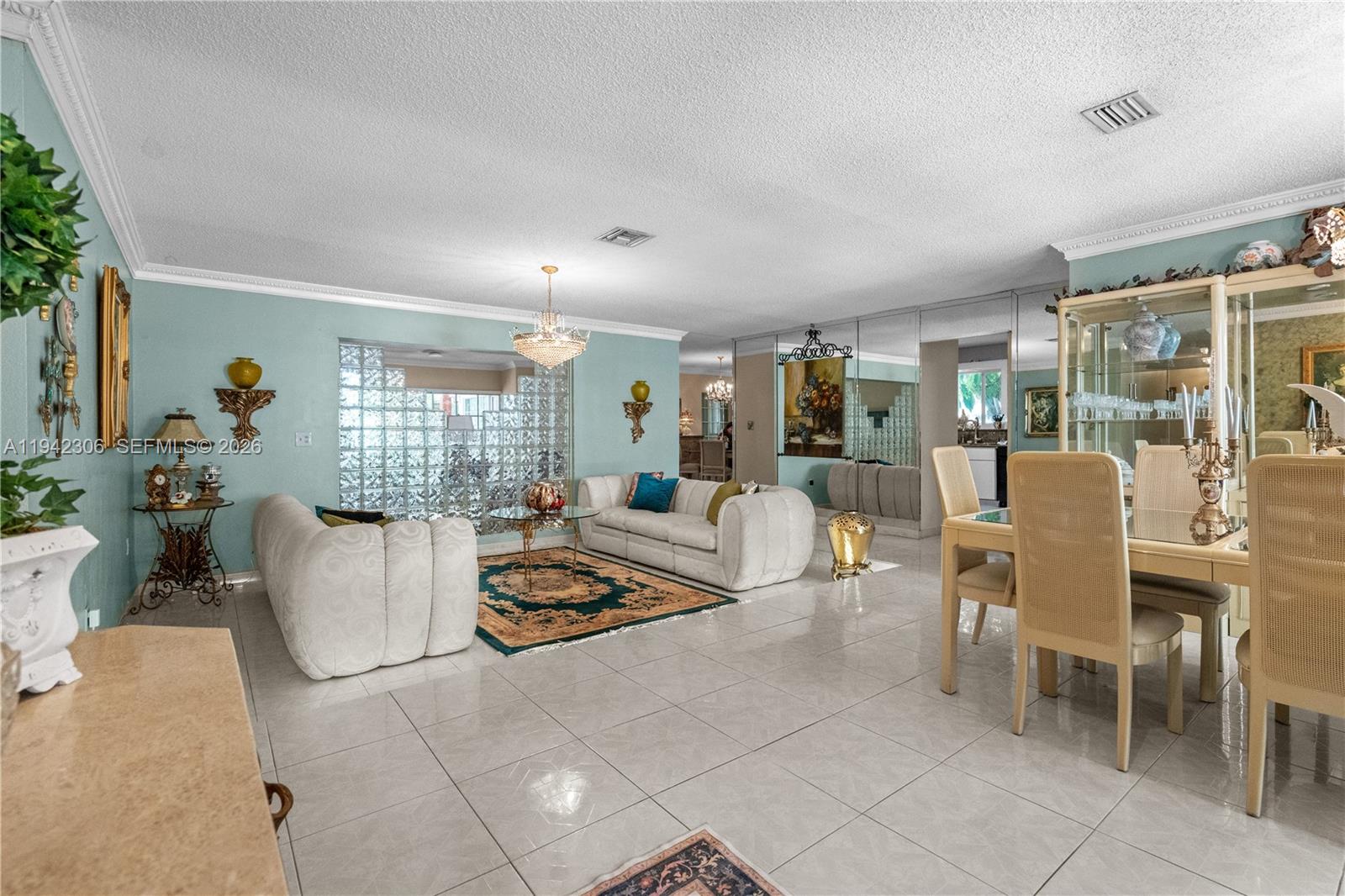13220 Southwest 5th Street Miami, FL 33184 - Photo 8 of 35 a living room with furniture a wooden floor and a large window