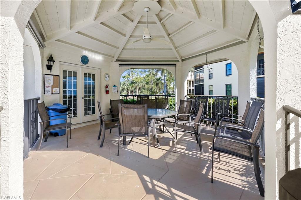 601 Augusta Boulevard, Unit 10 Naples, FL 34113 - Photo 21 of 27 View of patio / terrace featuring french doors and outdoor dining space