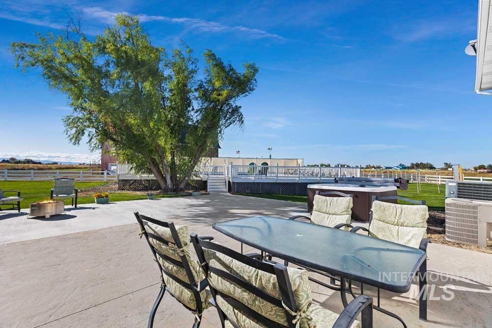 7165 South Linder Road Meridian, ID 83642 - Photo 29 of 40 View of patio with outdoor dining space and a hot tub