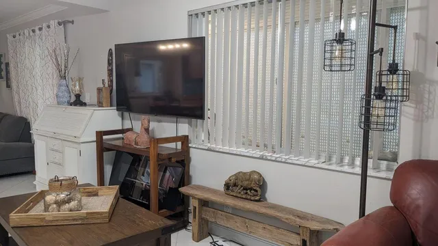 a living room with furniture and a window