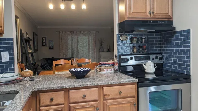 a kitchen with a stove and a microwave
