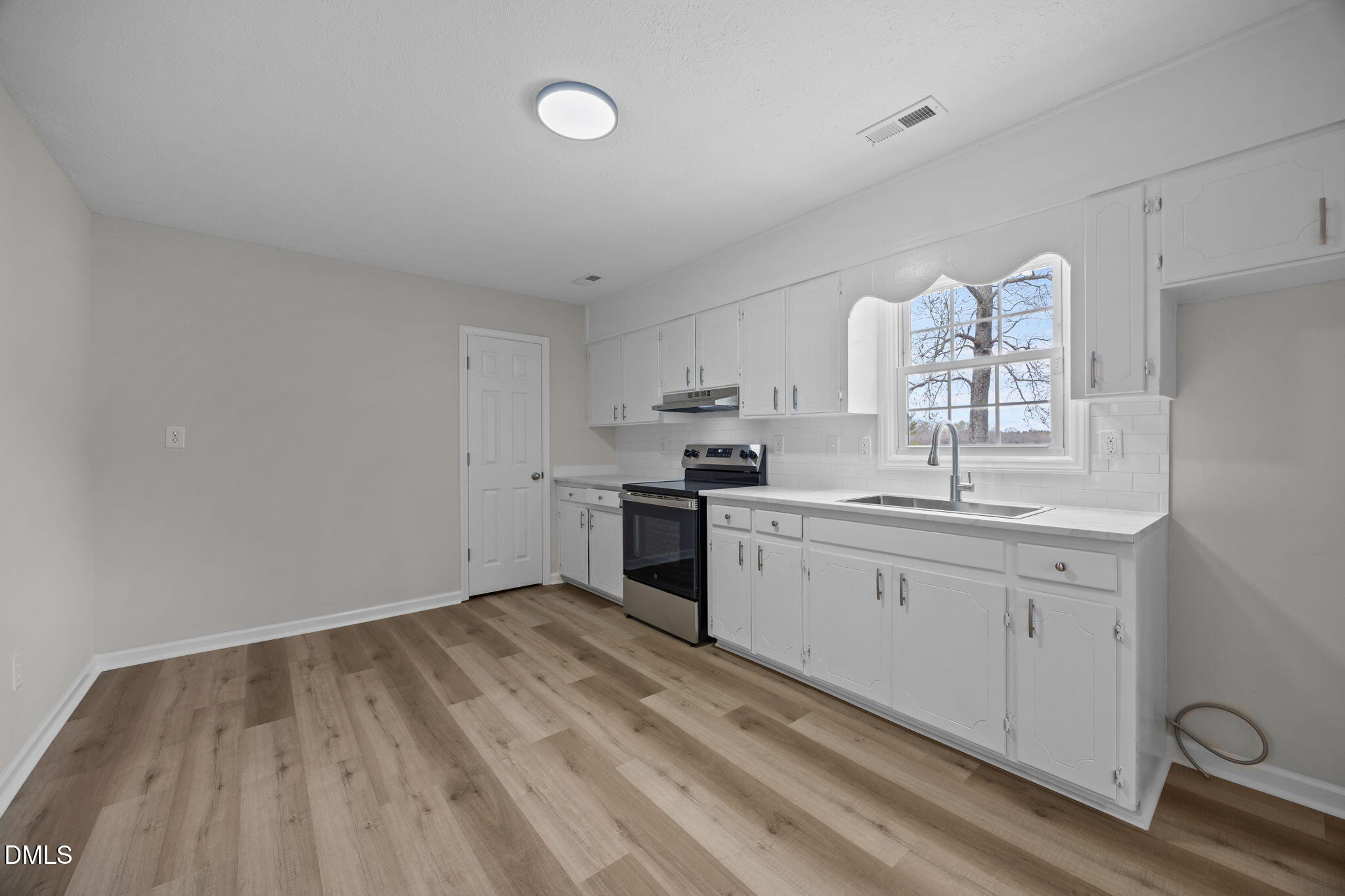 3285 Free Union Church Road Pinetown, NC 27865 - Photo 11 of 41 a kitchen with granite countertop a sink cabinets stainless steel appliances and a counter space