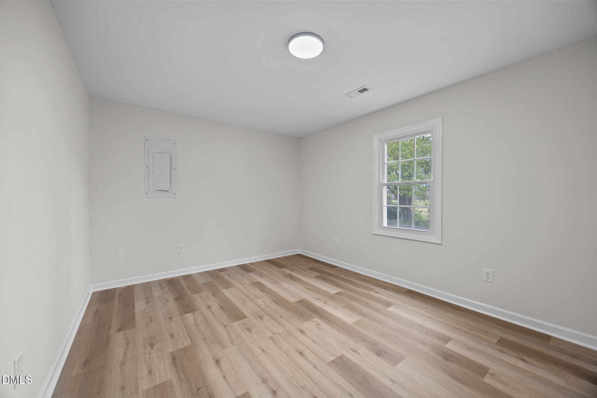 3285 Free Union Church Road Pinetown, NC 27865 - Photo 22 of 41 an empty room with wooden floor and windows
