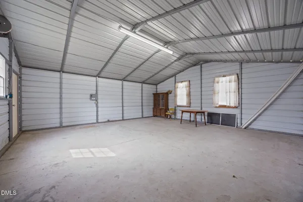a view of an empty room with a windows