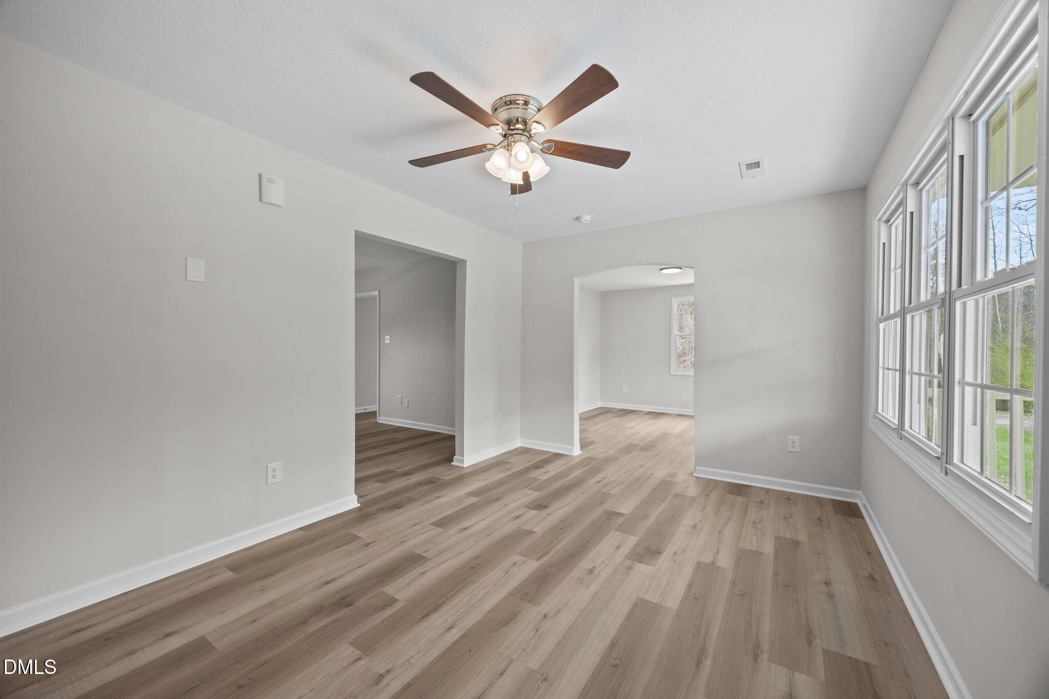3285 Free Union Church Road Pinetown, NC 27865 - Photo 4 of 41 a view of an empty room with window and wooden floor