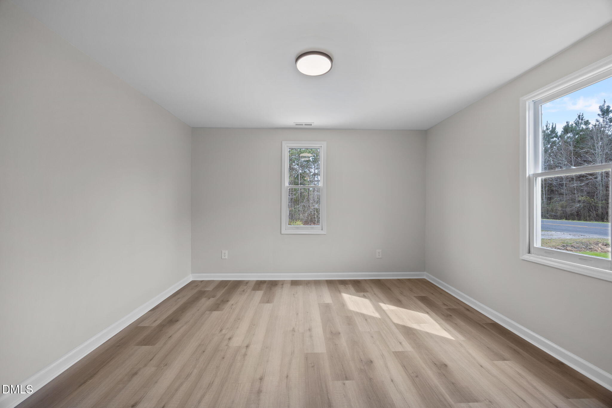 3285 Free Union Church Road Pinetown, NC 27865 - Photo 7 of 41 a view of room with window and hardwood floor