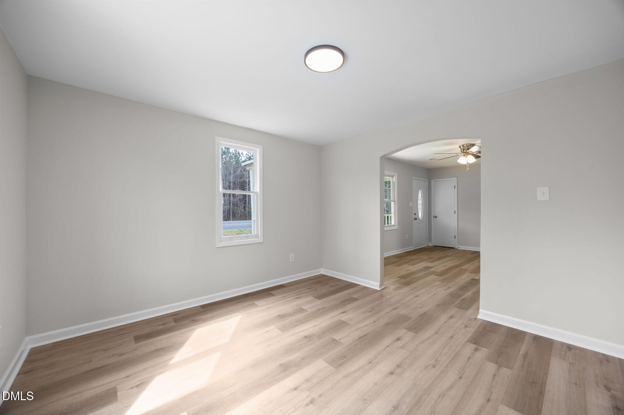 3285 Free Union Church Road Pinetown, NC 27865 - Photo 8 of 41 a view of an empty room with wooden floor and a window