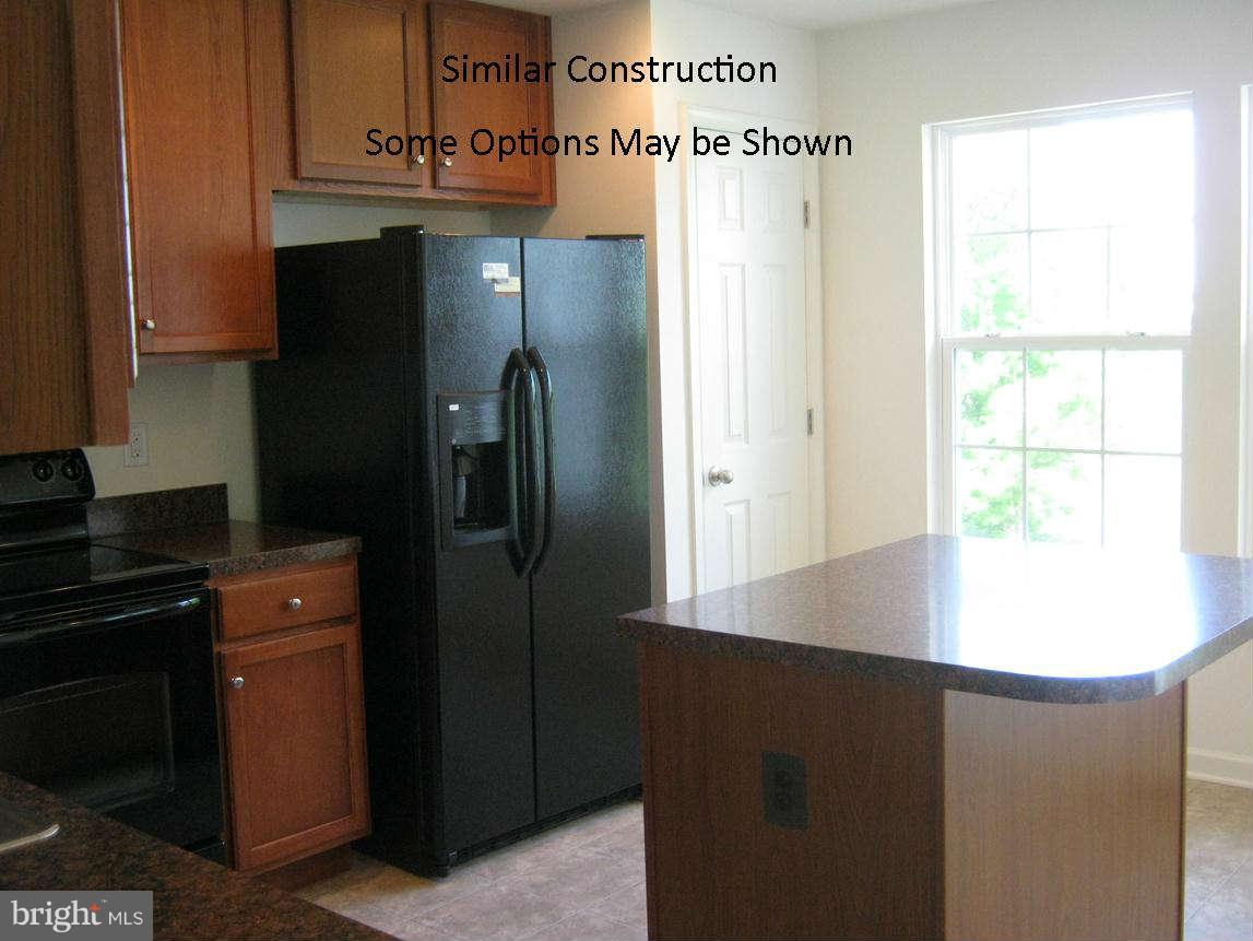 0 Stallion Street Ranson, WV 25438 - Photo 5 of 25 a kitchen with stainless steel appliances a refrigerator and a stove