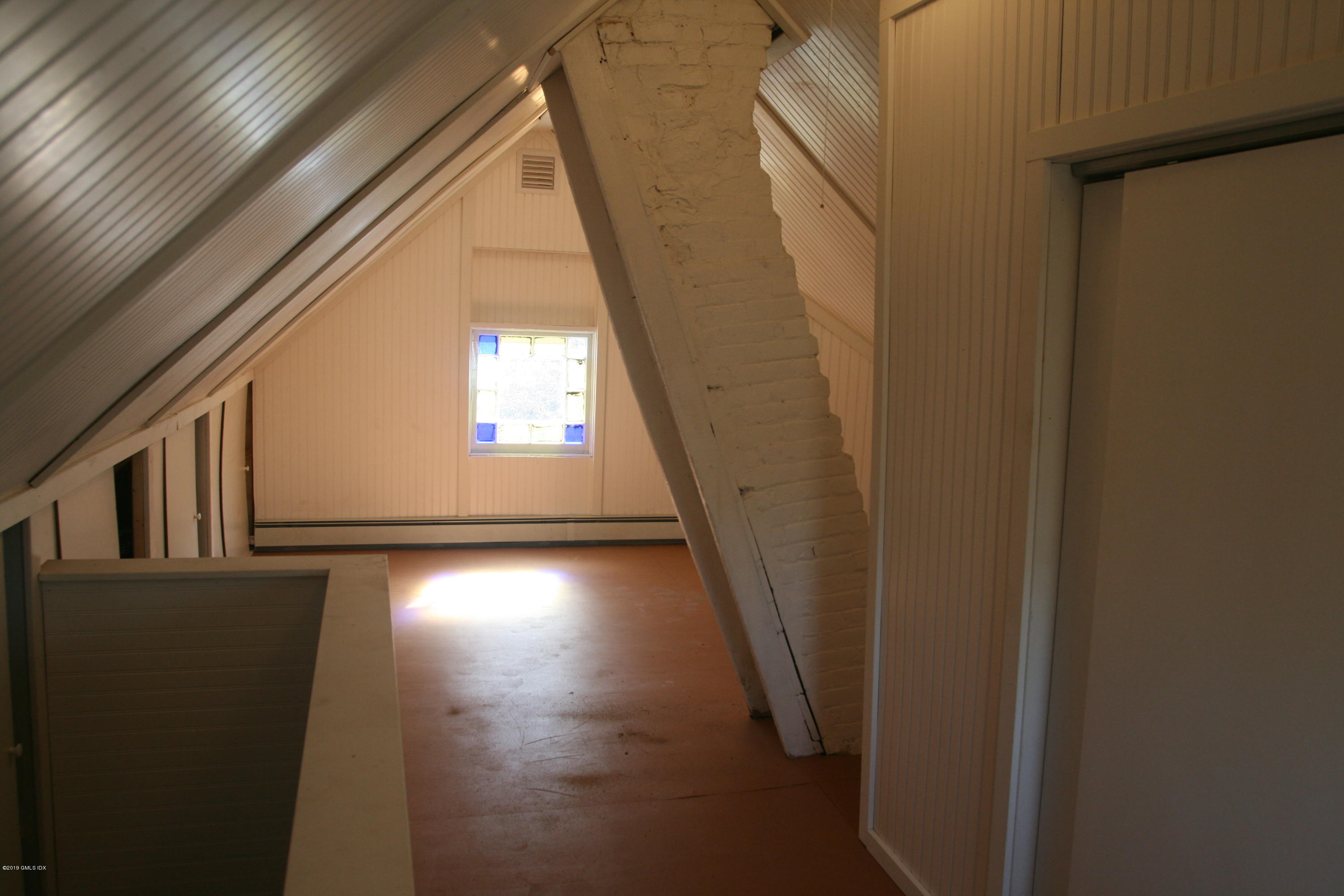 21 Byram Road Greenwich, CT 06830 - Photo 11 of 53 a view of a hallway with wooden floor and stairs