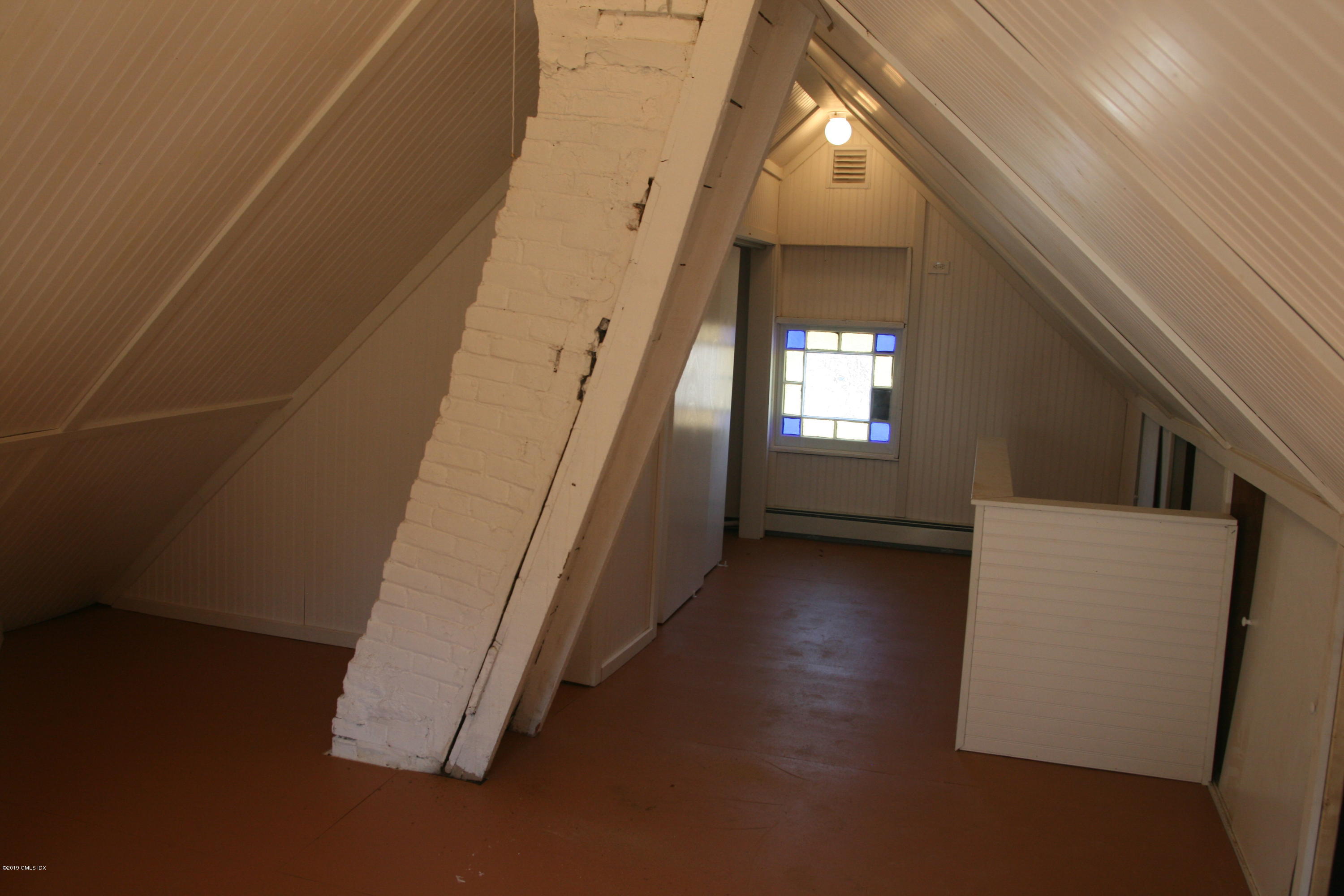 21 Byram Road Greenwich, CT 06830 - Photo 12 of 53 a view of an empty room with wooden floor and windows