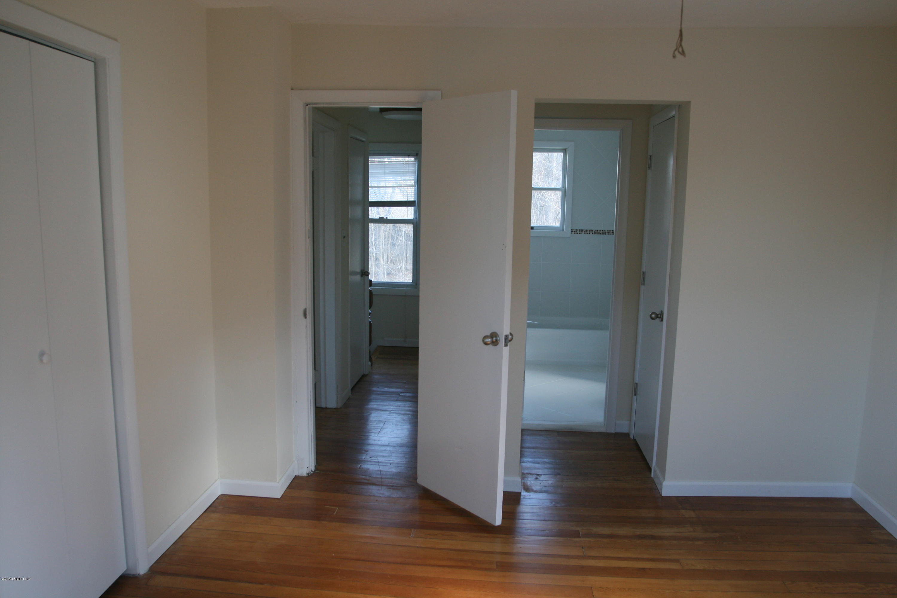 21 Byram Road Greenwich, CT 06830 - Photo 13 of 53 a view of a hallway with wooden floor