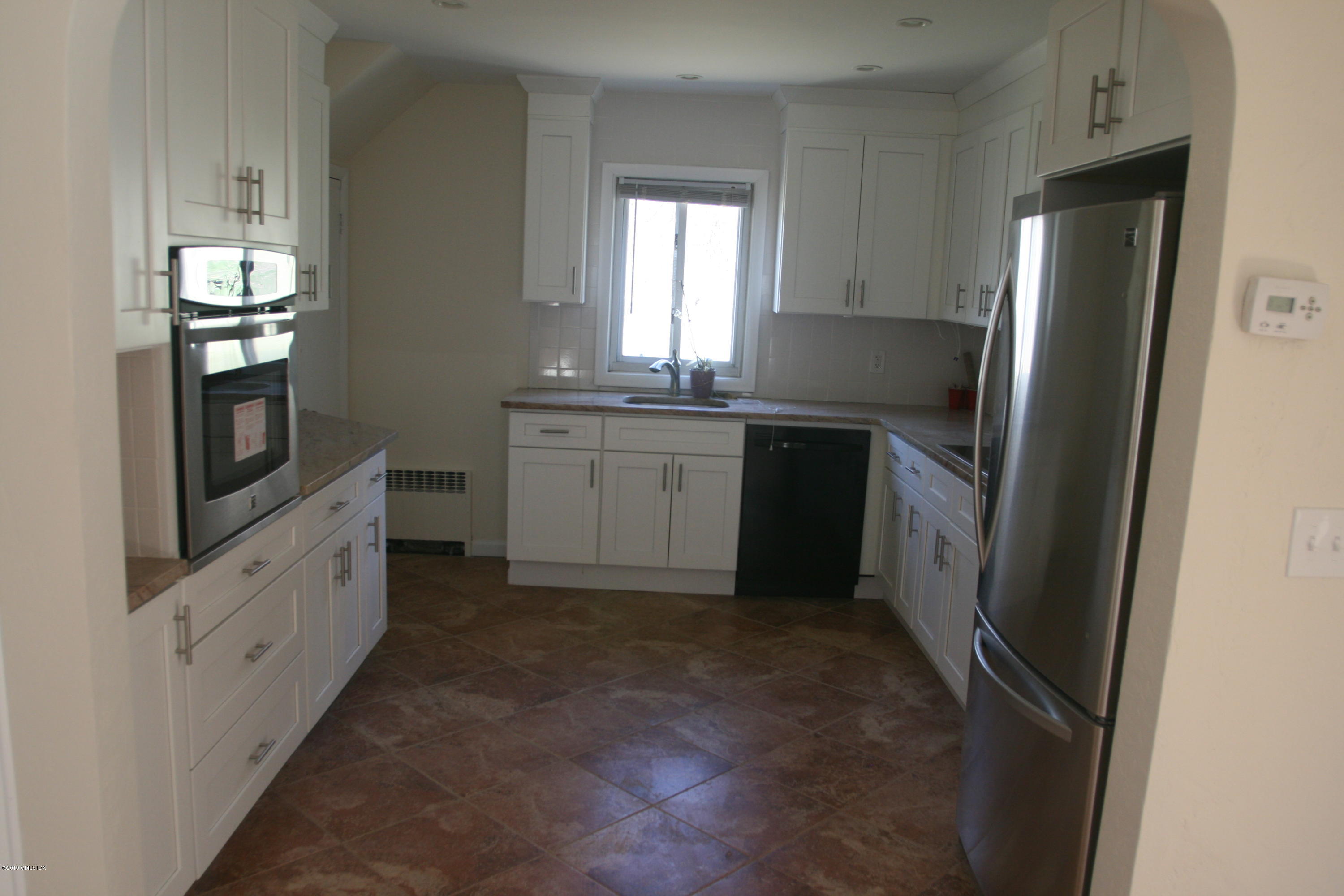 21 Byram Road Greenwich, CT 06830 - Photo 2 of 53 a kitchen with granite countertop a refrigerator and a sink