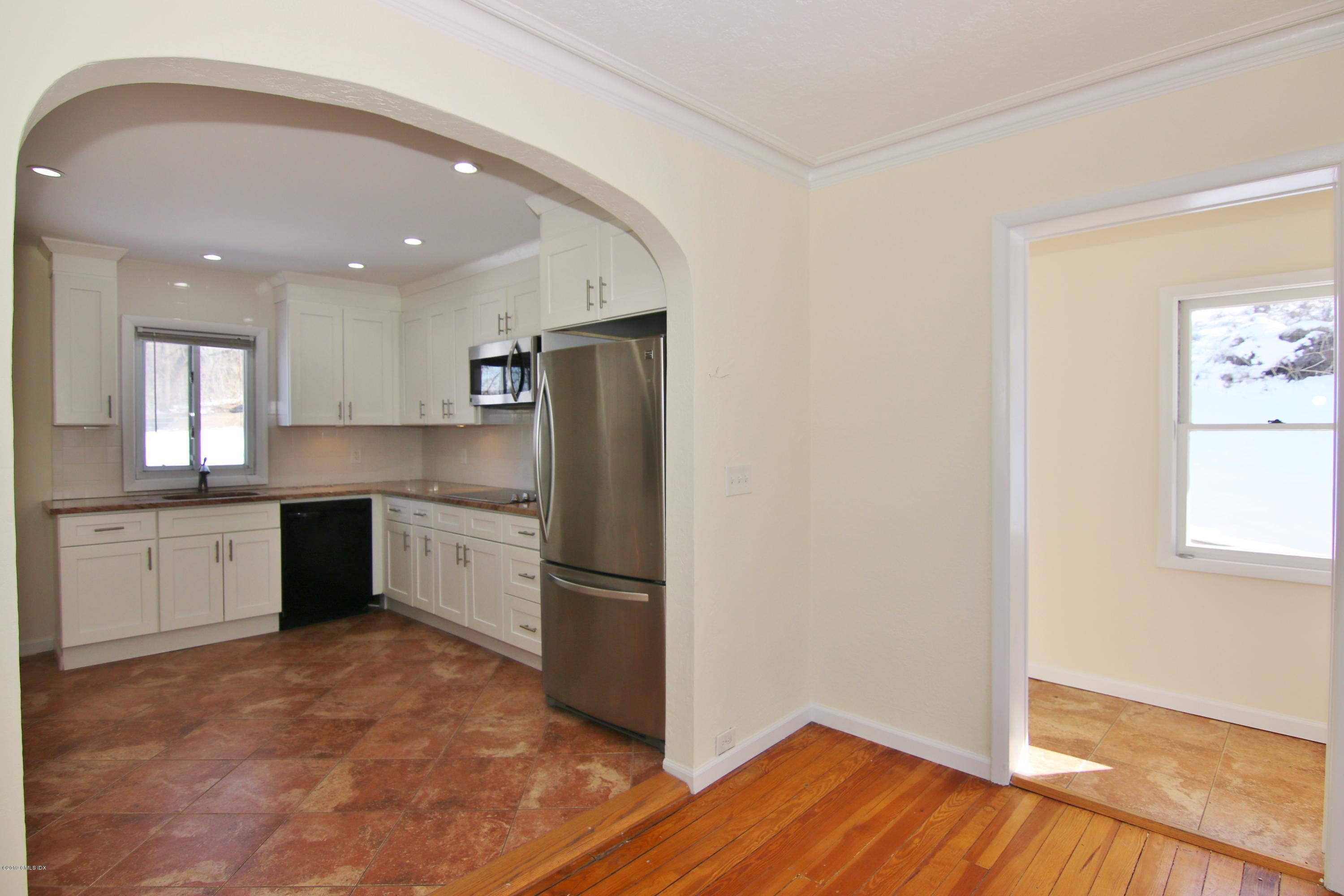 21 Byram Road Greenwich, CT 06830 - Photo 26 of 53 a kitchen with a refrigerator and a stove top oven