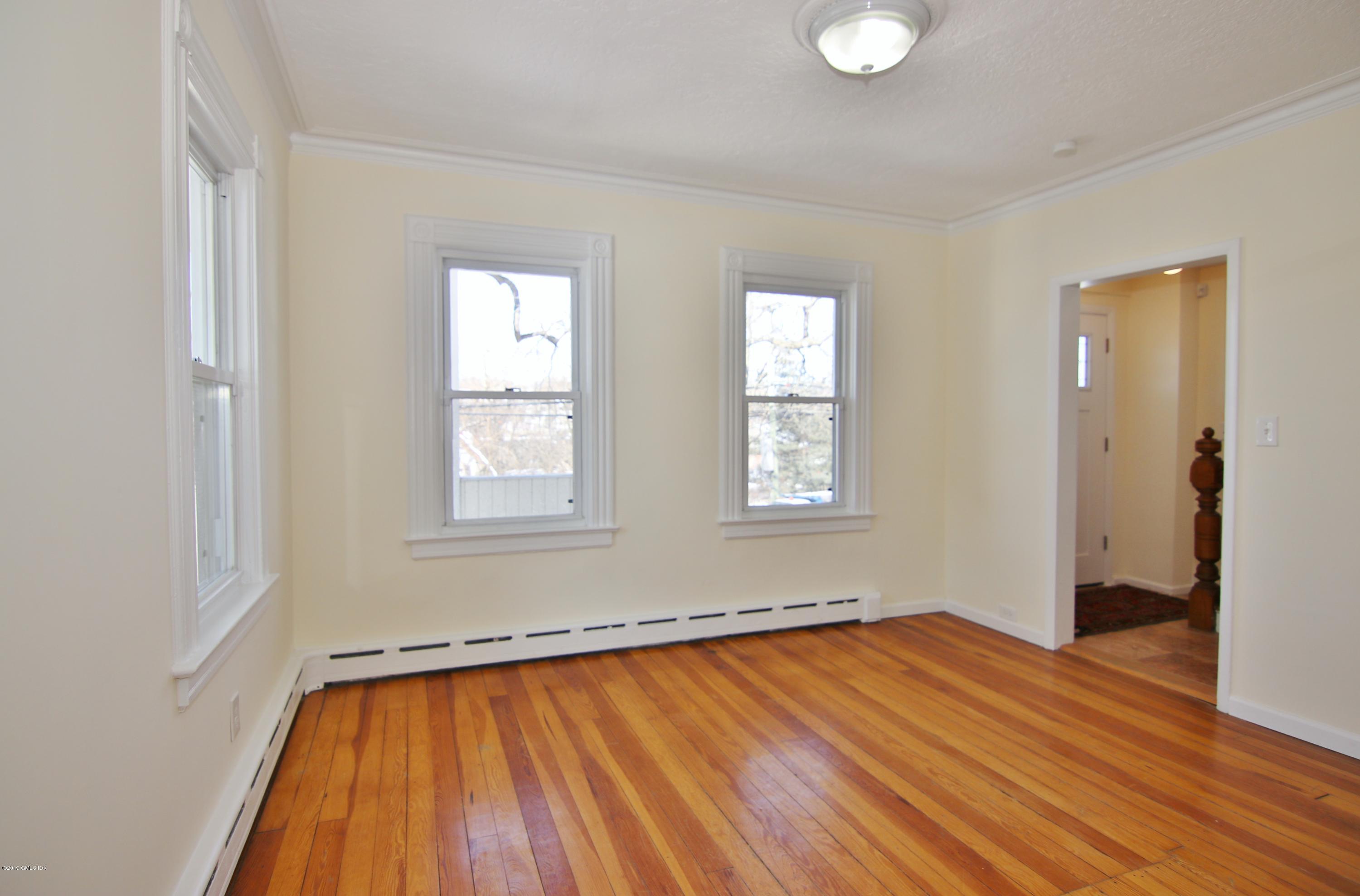 21 Byram Road Greenwich, CT 06830 - Photo 29 of 53 a view of empty room with wooden floor and fan