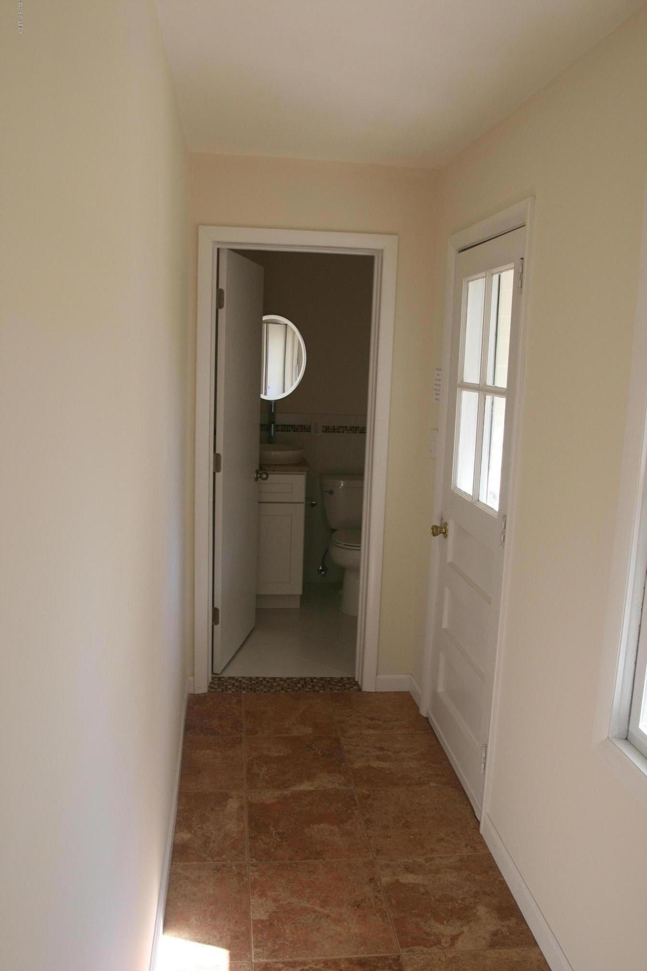 21 Byram Road Greenwich, CT 06830 - Photo 4 of 53 a view of a hallway with wooden floor and closet