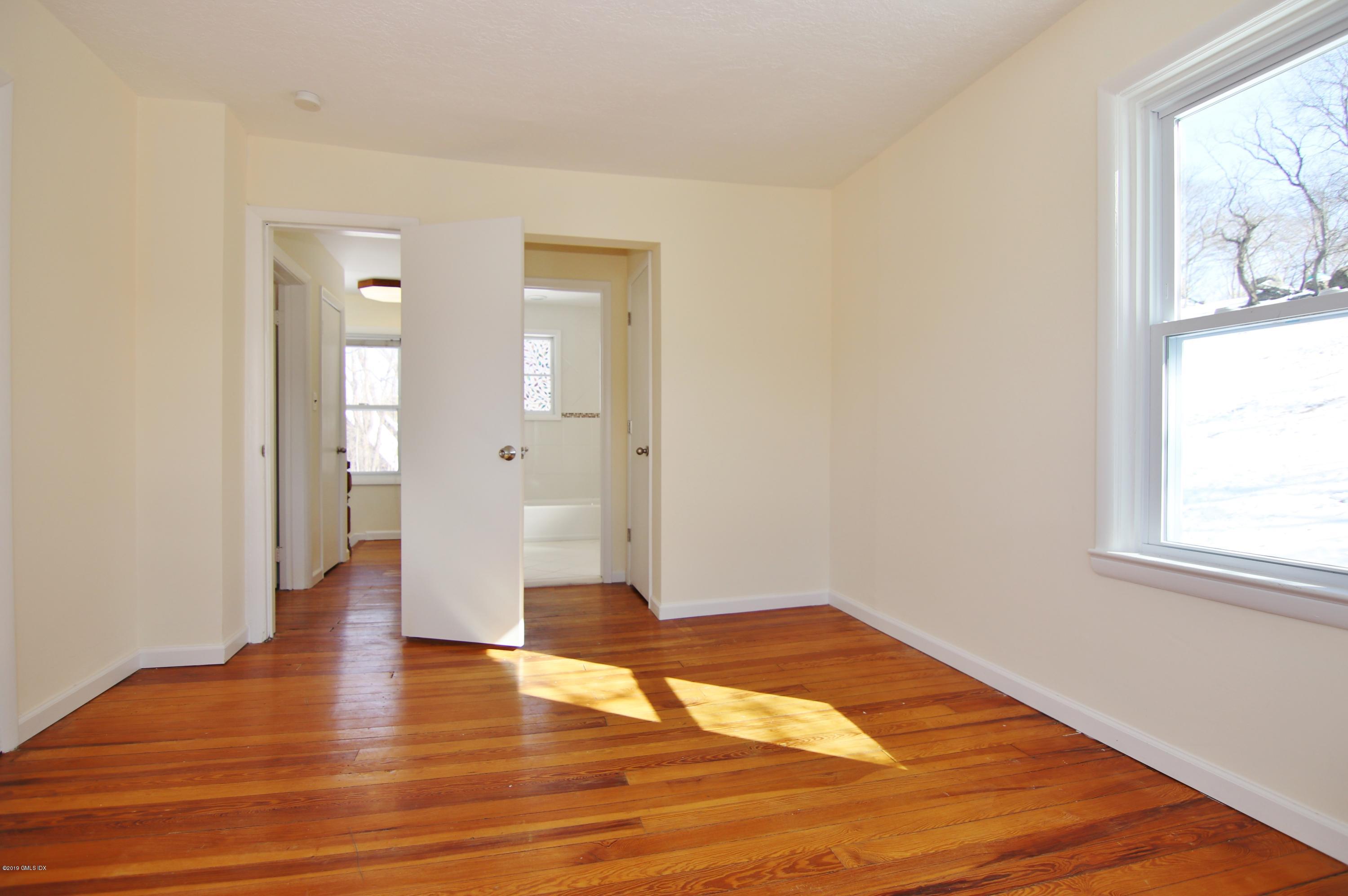 21 Byram Road Greenwich, CT 06830 - Photo 44 of 53 a view of empty room with wooden floor and fan
